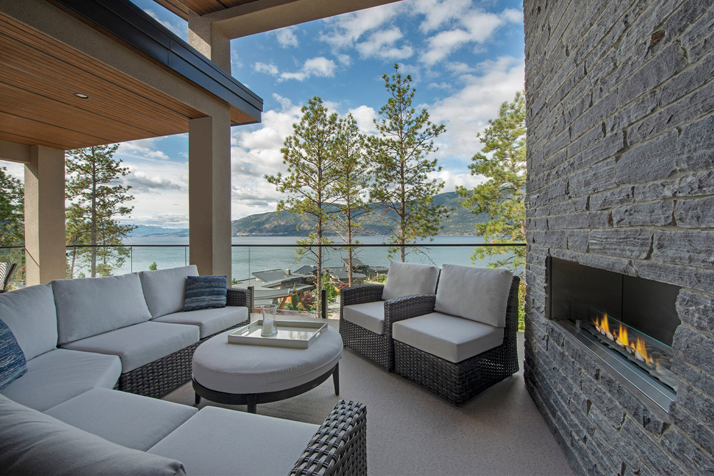 outdoor living area with stone fireplace