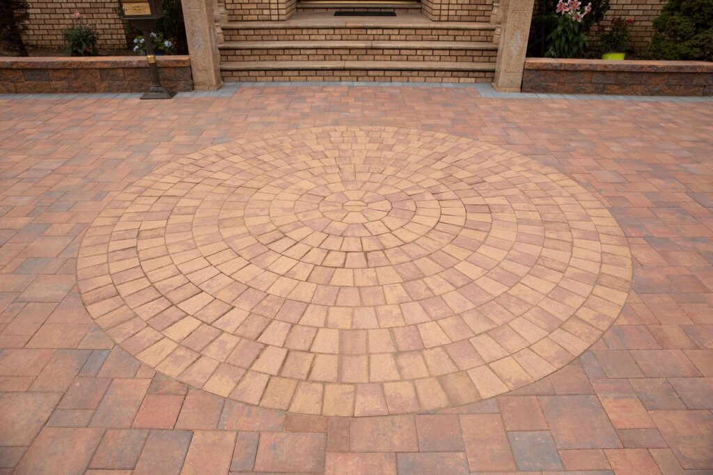 A picture of a NICOLOCK circular pattern inset in walkway