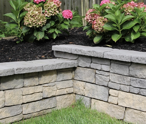 A picture of a nicolock concrete block wall in a natural style