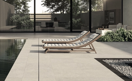 Picture of a patio and pool deck using limestone style outdoor porcelain tiles