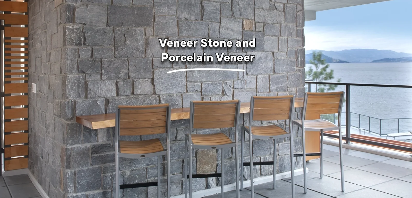 A picture of a lakeside home with stone veneer of one of the many thin veneer stone options we offer