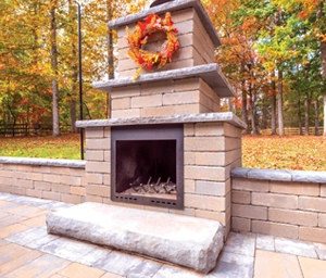 picture of a traditional wood fireplace jit from Nicolock in a classic style