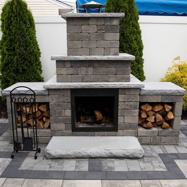 a picture of a nicolock fireplace in the field