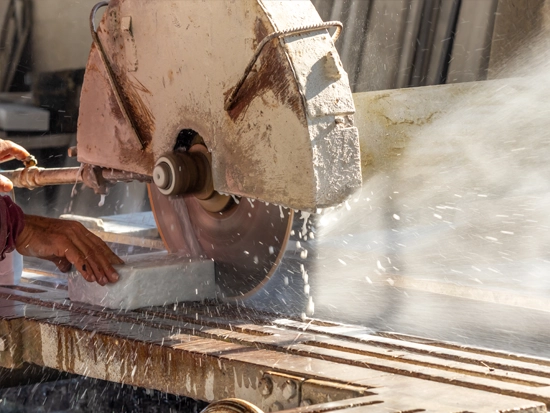 Picture of a wet stone saw cutting a stone tread